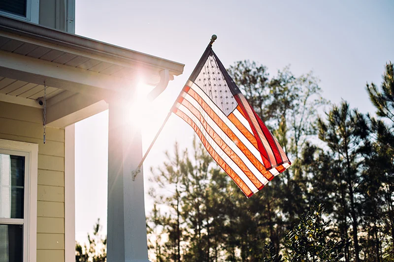 American flag on a house porch